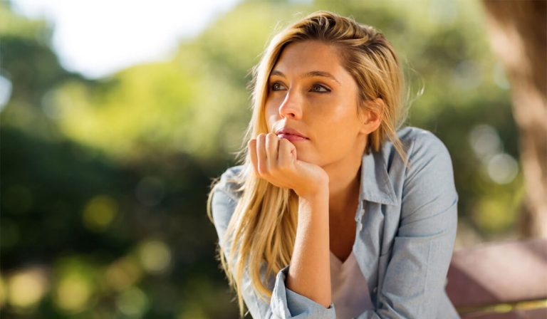 Woman thinking about the risk of the abortion pill.