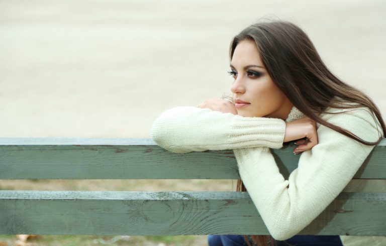 Woman on bench thinking